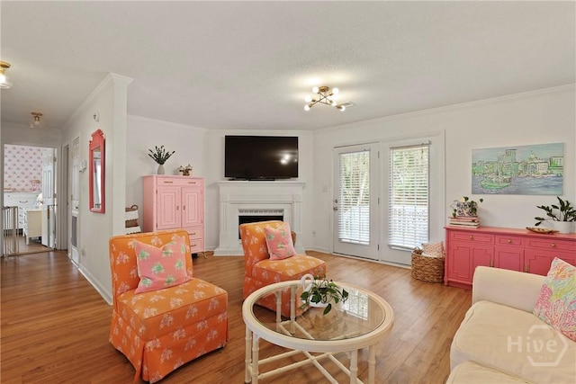 5109 Laroche Ave, Savannah, GA 31404 - living room with crown molding, light wood-type flooring, and a fireplace with raised hearth