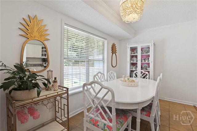 5109 Laroche Ave, Savannah, GA 31404 - dining area with healthy amount of natural light, light tile patterned floors, a chandelier, and crown molding