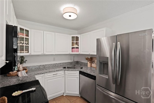5109 Laroche Ave, Savannah, GA 31404 - kitchen with stainless steel appliances, a sink, white cabinets, crown molding, and a textured ceiling