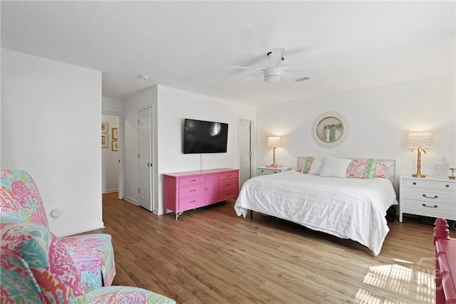 5109 Laroche Ave, Savannah, GA 31404 - bedroom with wood finished floors, ceiling fan, and baseboards
