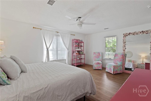 5109 Laroche Ave, Savannah, GA 31404 - bedroom featuring wood finished floors, a ceiling fan, and a textured ceiling