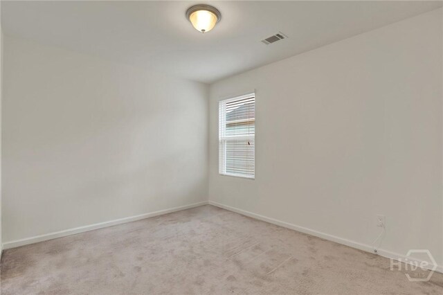 106 Tanzania Trl, Pooler, GA 31322 - empty room featuring light carpet and baseboards