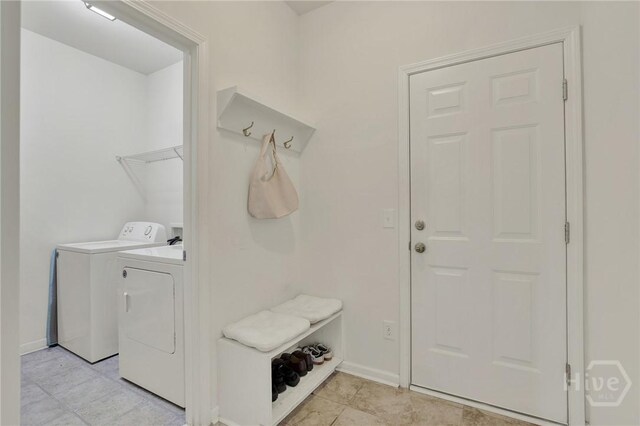 106 Tanzania Trl, Pooler, GA 31322 - laundry area with separate washer and dryer, baseboards, and light tile patterned floors