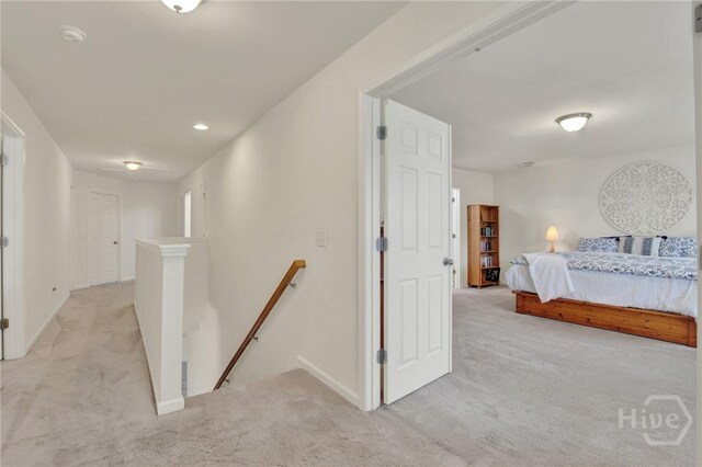 106 Tanzania Trl, Pooler, GA 31322 - hallway featuring an upstairs landing, light carpet, and baseboards