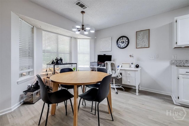 5 Sugar Cane Dr, Savannah, GA 31419 - dining room with a chandelier, light wood-style floors, baseboards, a textured ceiling, and a desk
