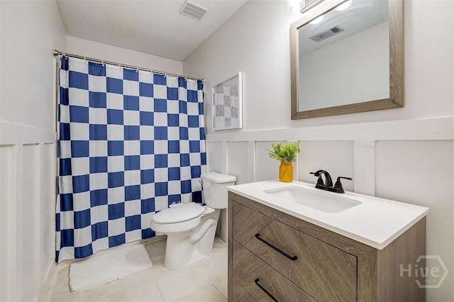 5 Sugar Cane Dr, Savannah, GA 31419 - bathroom with toilet, tile patterned floors, vanity, a shower with shower curtain, and a wainscoted wall