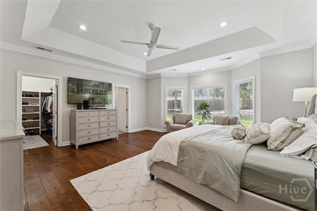 2 Dalry Ln, Savannah, GA 31419 - bedroom with a tray ceiling, hardwood / wood-style flooring, ornamental molding, a walk in closet, and recessed lighting