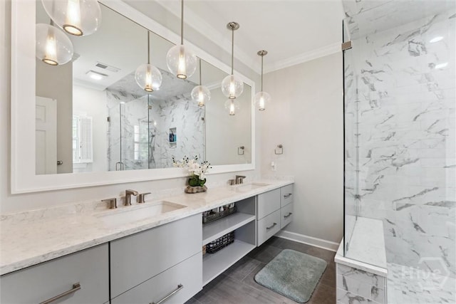 2 Dalry Ln, Savannah, GA 31419 - bathroom featuring double vanity, a marble finish shower, ornamental molding, and baseboards