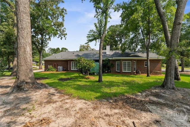 2 Dalry Ln, Savannah, GA 31419 - view of front of property featuring brick siding, a chimney, and a front yard