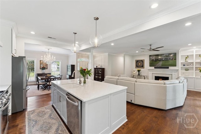 2 Dalry Ln, Savannah, GA 31419 - kitchen with appliances with stainless steel finishes, a sink, crown molding, dark wood finished floors, and white cabinetry