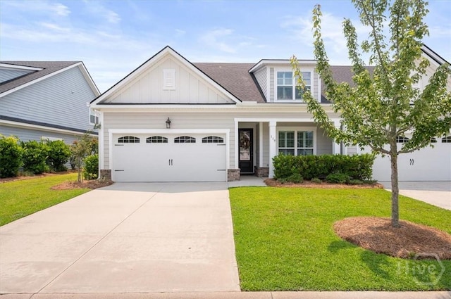 119 Danbury Ct, Pooler, GA 31322 - view of front of house featuring board and batten siding, a front lawn, driveway, and a garage