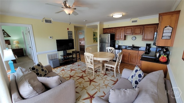 18 Silver Ave Unit 4, Tybee Island, GA 31328 - living room with ceiling fan and crown molding