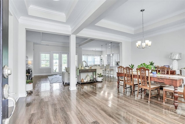 214 Park Chase Chase, Pooler, GA 31322 - dining area with a chandelier, wood finished floors, a raised ceiling, baseboards, and ornamental molding