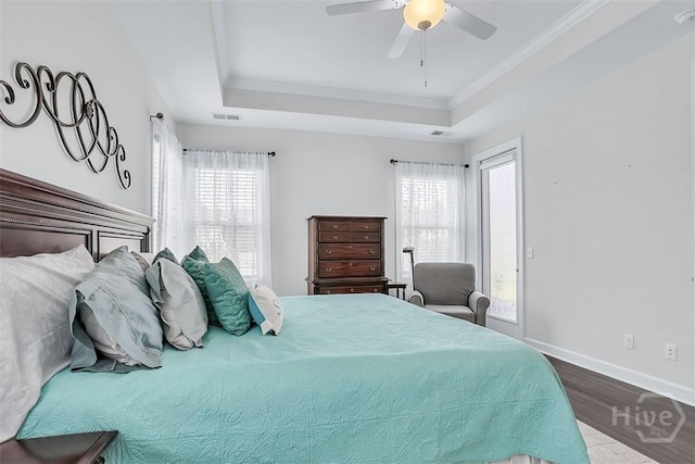 214 Park Chase Chase, Pooler, GA 31322 - bedroom featuring a tray ceiling, wood finished floors, multiple windows, ornamental molding, and baseboards