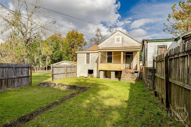1023 W 37th St, Savannah, GA 31415 - back of property with stucco siding and a porch