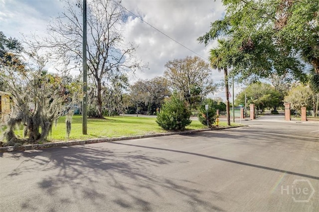 1023 W 37th St, Savannah, GA 31415 - view of asphalt road featuring curbs