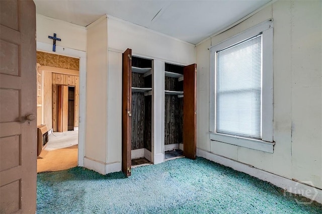1023 W 37th St, Savannah, GA 31415 - unfurnished bedroom with carpet flooring, multiple windows, and a closet