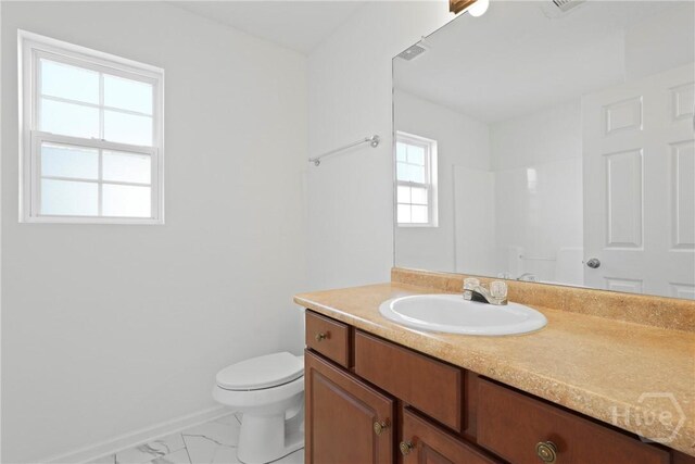 315 S Bridgeport Dr, Statesboro, GA 30461 - full bath with marble finish floors, toilet, vanity, baseboards, and a shower
