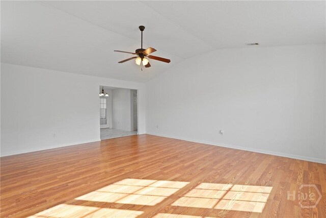 315 S Bridgeport Dr, Statesboro, GA 30461 - unfurnished room featuring vaulted ceiling, ceiling fan, light wood-style flooring, and baseboards