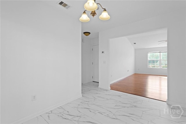 315 S Bridgeport Dr, Statesboro, GA 30461 - unfurnished room featuring marble look tiles, baseboards, and a chandelier