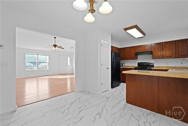315 S Bridgeport Dr, Statesboro, GA 30461 - kitchen with black appliances, light marble finish flooring, light countertops, and a sink