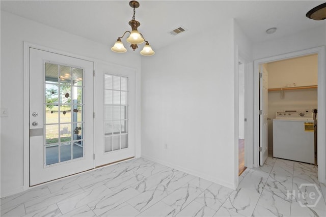 315 S Bridgeport Dr, Statesboro, GA 30461 - unfurnished dining area featuring washer / clothes dryer, light marble finish flooring, a chandelier, and baseboards