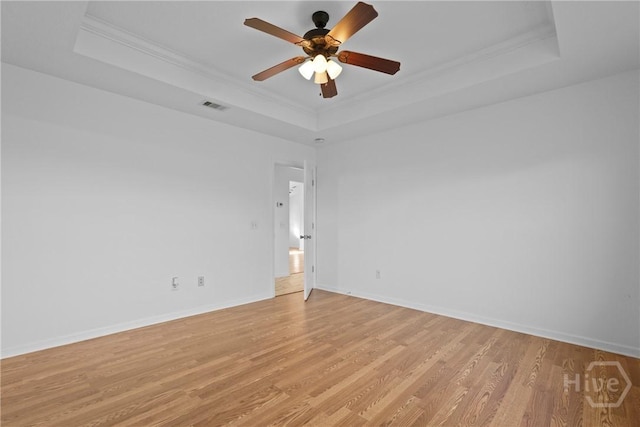 315 S Bridgeport Dr, Statesboro, GA 30461 - unfurnished room featuring a raised ceiling, light wood finished floors, ornamental molding, a ceiling fan, and baseboards