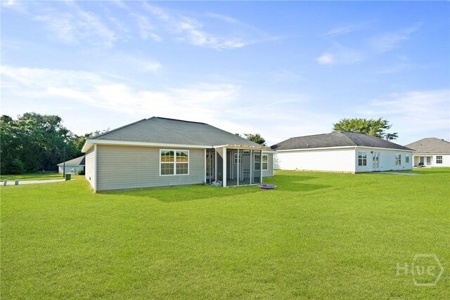 315 S Bridgeport Dr, Statesboro, GA 30461 - rear view of house featuring a sunroom and a yard