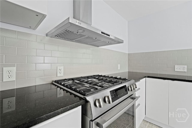 710 W 36th St, Savannah, GA 31415 - kitchen featuring wall chimney range hood, stainless steel gas stove, tasteful backsplash, and white cabinets
