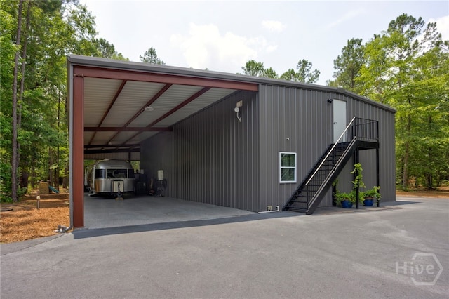 4000 Old River Rd S, Brooklet, GA 30415 - view of parking / parking lot with a carport, stairway, and asphalt driveway