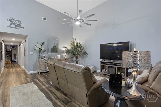 4000 Old River Rd S, Brooklet, GA 30415 - living room featuring a ceiling fan, dark wood finished floors, baseboards, and high vaulted ceiling