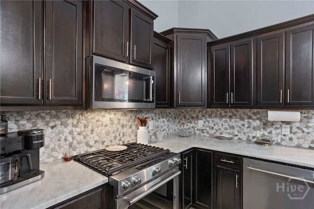 4000 Old River Rd S, Brooklet, GA 30415 - kitchen with appliances with stainless steel finishes, tasteful backsplash, dark brown cabinets, and light stone counters