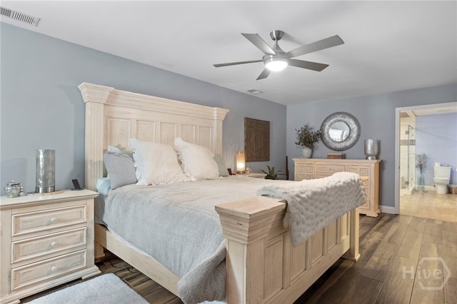 4000 Old River Rd S, Brooklet, GA 30415 - bedroom with dark wood-style flooring, ensuite bathroom, ceiling fan, and baseboards