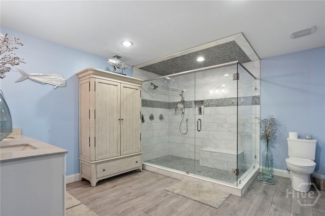 4000 Old River Rd S, Brooklet, GA 30415 - bathroom with toilet, wood finished floors, recessed lighting, a stall shower, and vanity