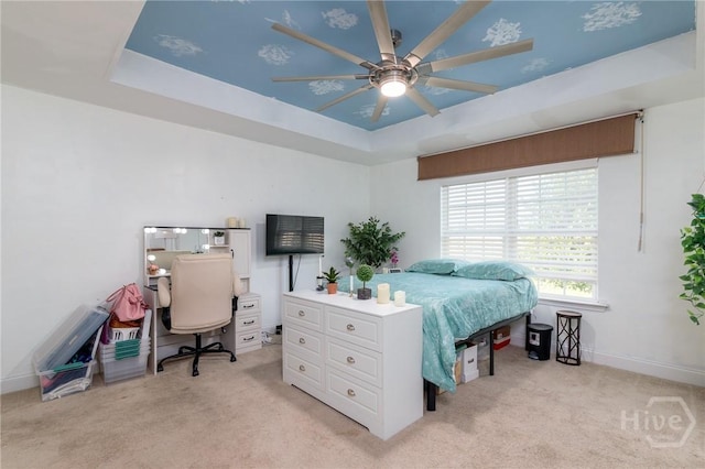 157 Stonebrook Way, Statesboro, GA 30458 - bedroom featuring a tray ceiling, light carpet, a ceiling fan, and baseboards