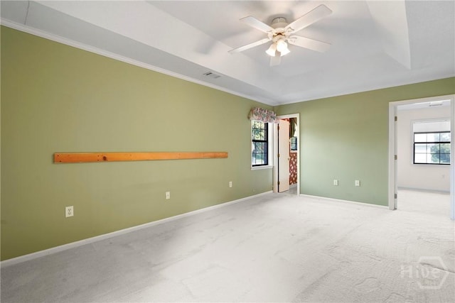 145 Cardinal Rd, Savannah, GA 31406 - empty room featuring carpet flooring, a ceiling fan, crown molding, baseboards, and a raised ceiling