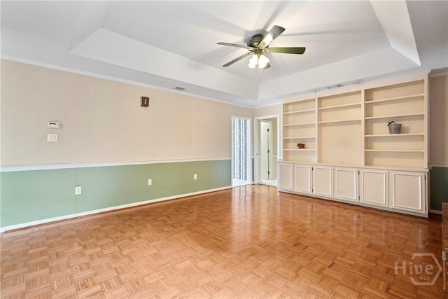 145 Cardinal Rd, Savannah, GA 31406 - unfurnished room featuring a tray ceiling, ceiling fan, baseboards, and built in features