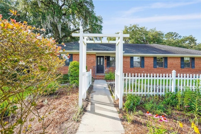 145 Cardinal Rd, Savannah, GA 31406 - view of front of property featuring a fenced front yard, brick siding, and a shingled roof