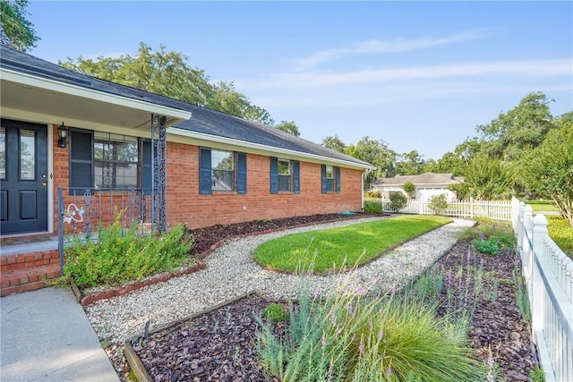 145 Cardinal Rd, Savannah, GA 31406 - view of side of property featuring brick siding and roof with shingles