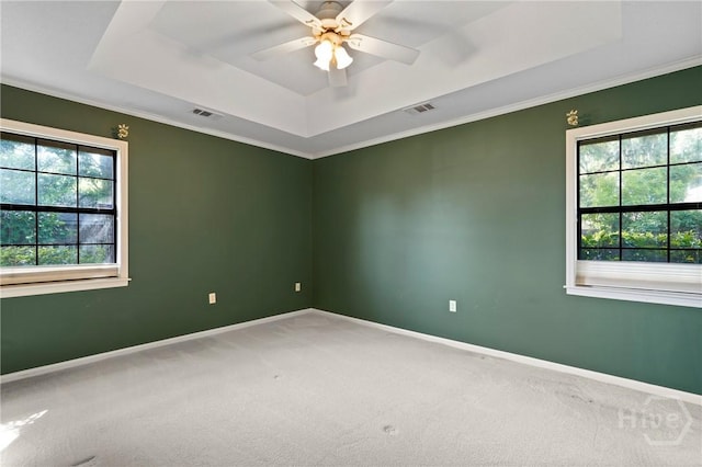 145 Cardinal Rd, Savannah, GA 31406 - unfurnished room featuring a tray ceiling, carpet flooring, baseboards, ceiling fan, and crown molding