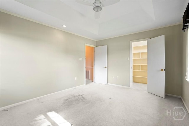 145 Cardinal Rd, Savannah, GA 31406 - unfurnished bedroom with carpet flooring, a walk in closet, ornamental molding, baseboards, and a ceiling fan