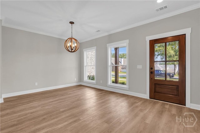 1362 Ebenezer Rd, Rincon, GA 31326 - entrance foyer featuring healthy amount of natural light, baseboards, a chandelier, light wood-style flooring, and crown molding