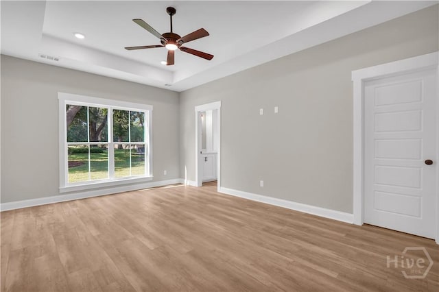 1362 Ebenezer Rd, Rincon, GA 31326 - unfurnished room with a raised ceiling, baseboards, light wood-style floors, and recessed lighting