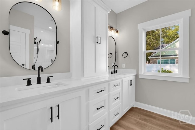 1362 Ebenezer Rd, Rincon, GA 31326 - full bath featuring double vanity, baseboards, wood finished floors, and a shower