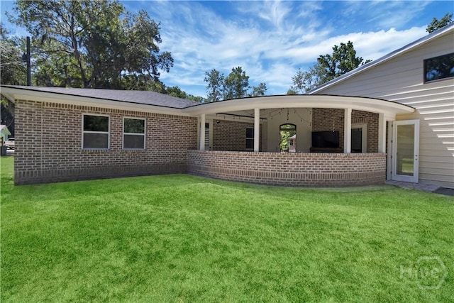 238-A W Magnolia Ave, Savannah, GA 31419 - back of house with brick siding and a lawn