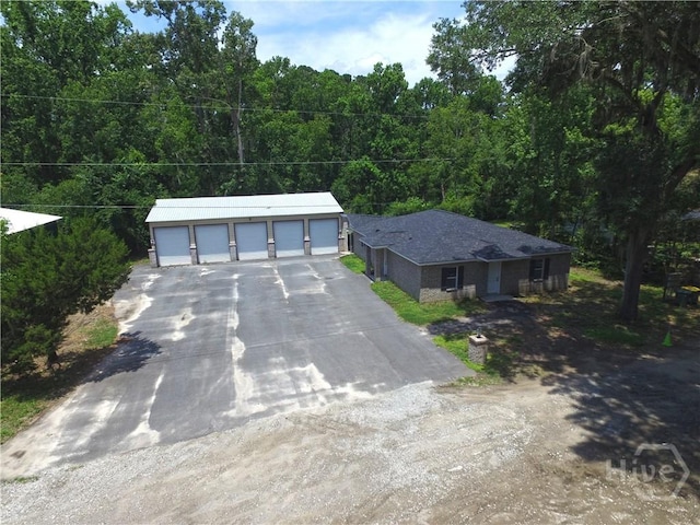 238-A W Magnolia Ave, Savannah, GA 31419 - ranch-style home featuring a garage and a wooded view