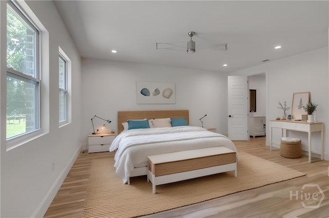 238-A W Magnolia Ave, Savannah, GA 31419 - bedroom with multiple windows, light wood-type flooring, recessed lighting, and baseboards