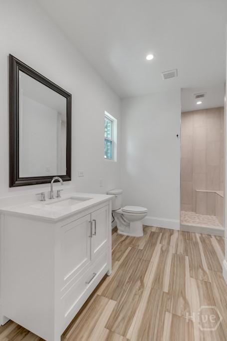 238-A W Magnolia Ave, Savannah, GA 31419 - full bathroom featuring vanity, toilet, a walk in shower, wood finished floors, and recessed lighting