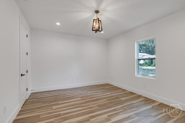 238-A W Magnolia Ave, Savannah, GA 31419 - spare room featuring light wood-style floors, baseboards, a chandelier, and recessed lighting