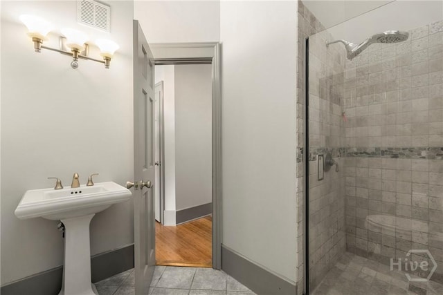301 W Broughton St Unit 3B, Savannah, GA 31401 - full bathroom featuring a shower stall and tile patterned flooring